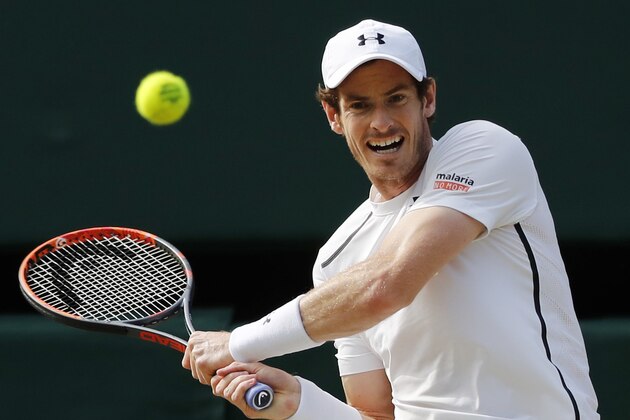 Andy Murray of Britain returns to Jo-Wilfried Tsonga of France during their men's singles match on day ten of the Wimbledon Tennis Championships in London, Wednesday, July 6, 2016. (AP Photo/Ben Curtis)