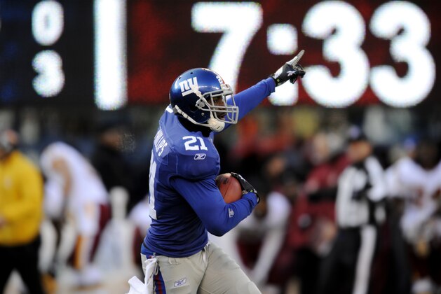 New York Giants strong safety Kenny Phillips gestures after intercepting Washington Redskins quarterback Rex Grossman, not pictured, during the first quarter of an NFL football game, Sunday, Dec. 18, 2011, in East Rutherford, N.J. (AP Photo/Bill Kostroun)