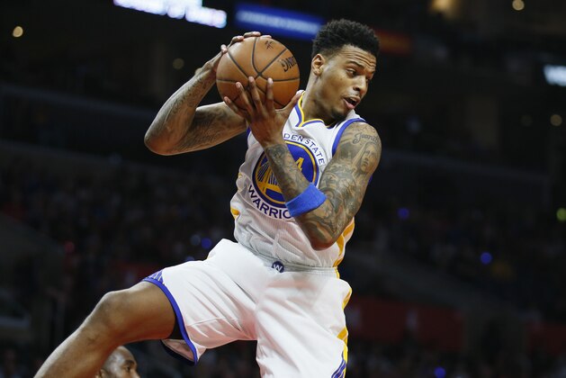 Golden State Warriors' Brandon Rush brings in a rebound against the Los Angeles Clippers during the first half of an NBA basketball game, Saturday, Feb. 20, 2016, in Los Angeles. (AP Photo/Danny Moloshok)