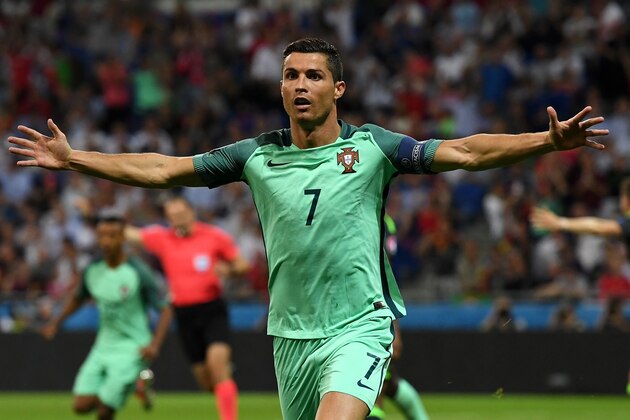 LYON, FRANCE - JULY 06:  Cristiano Ronaldo of Portugal celebrates scoring the opening goal during the UEFA EURO 2016 semi final match between Portugal and Wales at Stade des Lumieres on July 6, 2016 in Lyon, France.  (Photo by Stu Forster/Getty Images)
