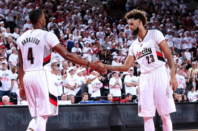 PORTLAND, OR - APRIL 23: Allen Crabbe #23 and Maurice Harkless #4 of the Portland Trail Blazers high five each other during the game against the Los Angeles Clippers in Game Three of the Western Conference Quarterfinals during the 2016 NBA Playoffs on April 23, 2016 at the Moda Center Arena in Portland, Oregon. NOTE TO USER: User expressly acknowledges and agrees that, by downloading and or using this photograph, user is consenting to the terms and conditions of the Getty Images License Agreement. Mandatory Copyright Notice: Copyright 2016 NBAE (Photo by Sam Forencich/NBAE via Getty Images)