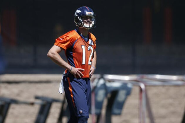 Denver Broncos rookie quarterback Paxton Lynch takes a break during drills at the NFL football team's practice Tuesday, June 14, 2016, at the Broncos' headquarters in Englewood, Colo. (AP Photo/David Zalubowski)