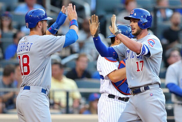 Jun 30, 2016; New York City, NY, USA; Chicago Cubs third baseman Kris Bryant (17) high fives right fielder Ben Zobrist (18) after hitting a two-run home run against New York Mets starting pitcher Steven Matz (not pictured) during the first inning at Citi Field. Mandatory Credit: Brad Penner-USA TODAY Sports