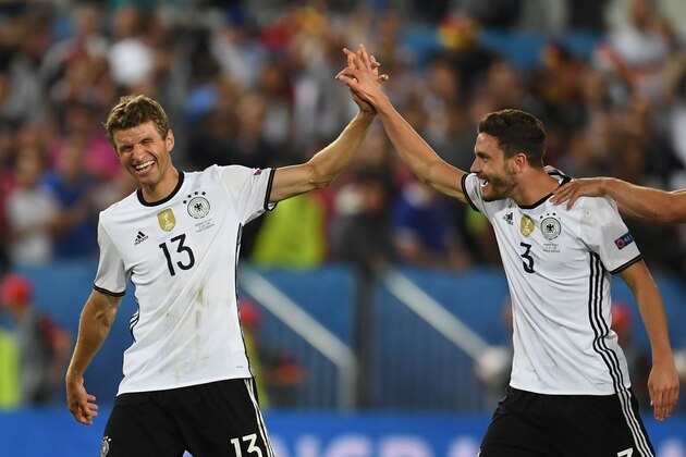 Germany's midfielder Thomas Mueller and Germany's defender Jonas Hector celebrate after winning the Euro 2016 quarter-final football match between Germany and Italy at the Matmut Atlantique stadium in Bordeaux on July 2, 2016.  / AFP / PATRIK STOLLARZ        (Photo credit should read PATRIK STOLLARZ/AFP/Getty Images)