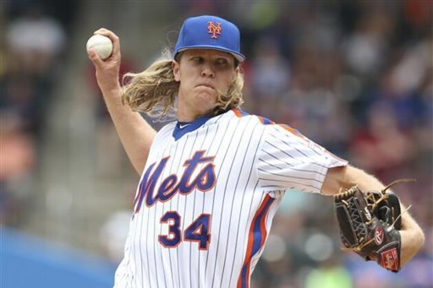 New York Mets starting pitcher Noah Syndergaard throws during the second inning of a baseball game against the Chicago Cubs, Sunday, July 3, 2016, in New York. (AP Photo/Seth Wenig)