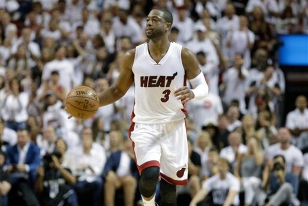 Miami Heat guard Dwyane Wade (3) moves the ball against the Toronto Raptors during the second half of Game 6 of the NBA basketball Eastern Conference semifinals, Friday, May 13, 2016, in Miami. The Heat won 103-91. (AP Photo/Alan Diaz)