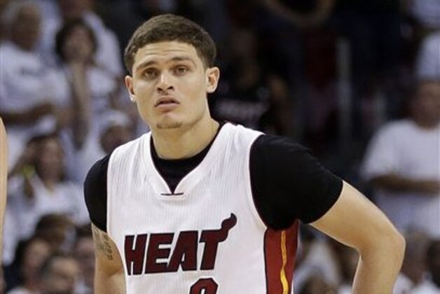 Miami Heat guard Tyler Johnson (8) walks on the court after a timeout during Game 7 of a first-round NBA basketball playoff series against the Charlotte Hornets, Sunday, May 1, 2016, in Miami.  (AP Photo/Alan Diaz)