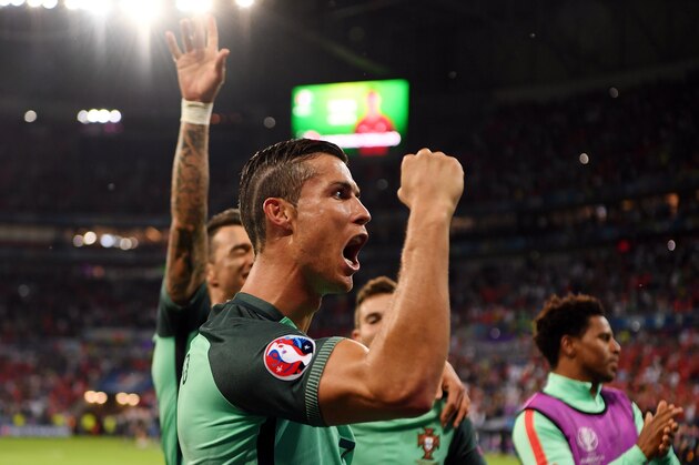 LYON, FRANCE - JULY 06:  Cristiano Ronaldo of Portugal celebrates victory after the UEFA EURO 2016 semi final match between Portugal and Wales at Stade des Lumieres on July 6, 2016 in Lyon, France.  (Photo by Matthias Hangst/Getty Images)