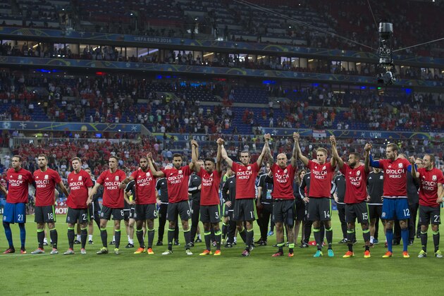 LYON, FRANCE - JULY 06:  Wales players salute the fans at full time during the UEFA Euro 2016 Semi-final match between Portugal and Wales at Stade de Lyon on July 06 in Lyon, France.  (Photo by Craig Mercer/CameraSport via Getty Images)