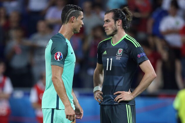 LYON, FRANCE - JULY 6: Cristiano Ronaldo of Portugal greets Gareth Bale of Wales following the UEFA Euro 2016 semi-final between Wales and Portugal at Parc OL, Stade des Lumieres on July 6, 2016 in Lyon, France. (Photo by Jean Catuffe/Getty Images)