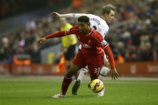 Liverpool's Jordon Ibe and Tottenham's Christian Eriksen challenge for the ball during the English Premier League soccer match between Liverpool and Tottenham Hotspur at Anfield Stadium, Liverpool, England, Tuesday Feb. 10, 2015. (AP Photo/Jon Super)