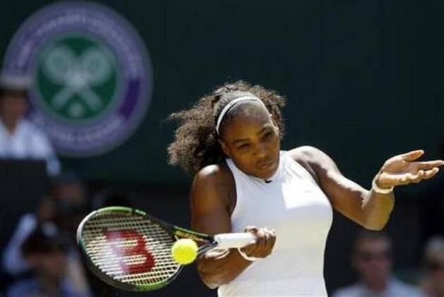 Serena Williams of the U.S returns to Elena Vesnina of Russia during their women's singles match on day eleven of the Wimbledon Tennis Championships in London, Thursday, July 7, 2016. (AP Photo/Kirsty Wigglesworth)