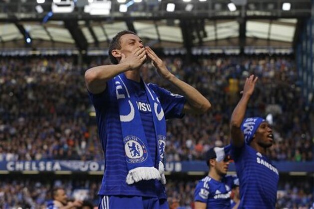 Chelsea's Nemanja Matic and Didier Drogba celebrate after the English Premier League soccer match between Chelsea and Crystal Palace at Stamford Bridge stadium in London, Sunday, May 3, 2015.  Chelsea won the match 1-0 to secure Premier League title with 3 games to spare.  (AP Photo/Kirsty Wigglesworth)