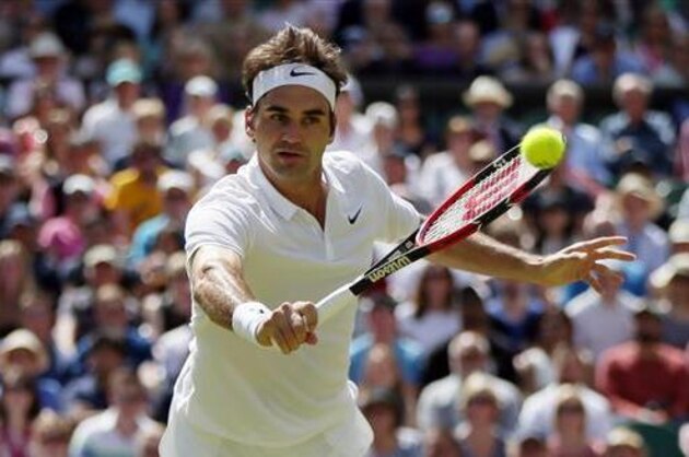 Roger Federer of Switzerland returns to Marin Cilic of Croatia during their men's singles match on day ten of the Wimbledon Tennis Championships in London, Wednesday, July 6, 2016. (AP Photo/Tim Ireland)