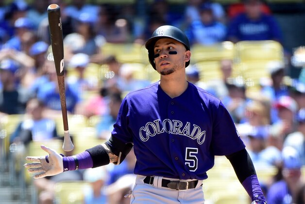 LOS ANGELES, CA - JULY 03:  Carlos Gonzalez #5 of the Colorado Rockies reacts to a swinging strike during the fourth inning against the Los Angeles Dodgers at Dodger Stadium on July 3, 2016 in Los Angeles, California.  (Photo by Harry How/Getty Images)
