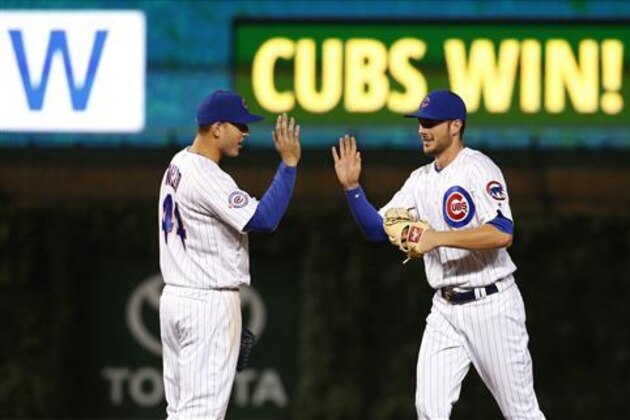 Chicago Cubs' Anthony Rizzo, left, celebrates with Kris Bryant after the Cubs defeated the Pittsburgh Pirates 4-3 in a baseball game Saturday, June 18, 2016, in Chicago. (AP Photo/Nam Y. Huh)