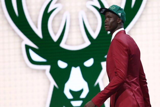 Jun 23, 2016; New York, NY, USA; Thon Maker walks off stage after being selected as the number ten overall pick to the Milwaukee Bucks in the first round of the 2016 NBA Draft at Barclays Center. Mandatory Credit: Jerry Lai-USA TODAY Sports