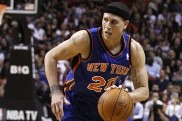 New York Knicks' Mike Bibby (20) dribbles the ball during the first half of an NBA basketball game against the Miami Heat, Friday, Jan. 27, 2012, in Miami. (AP Photo/Lynne Sladky)