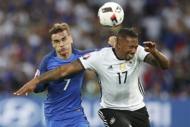 Germany's Jerome Boateng, right, challenges for the ball with France's Antoine Griezmann during the Euro 2016 semifinal soccer match between Germany and France, at the Velodrome stadium in Marseille, France, Thursday, July 7, 2016. (AP Photo/Petr David Josek)
