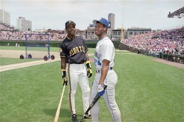 Barry Bonds, left, of the Pirates, and Ken Griffey, Jr., of the Mariners, chat during National League batting practice, Monday, July 9, 1990, for the 61st All-Star Game at Chicago's Wrigley field. Bonds and Griffey's dads were also both all-stars. (AP Photo/John Swart)