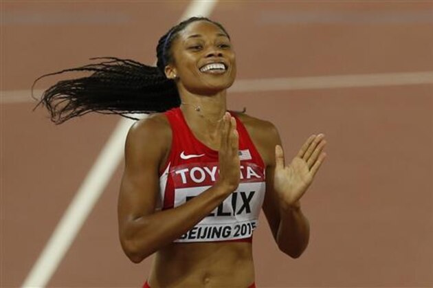 FILE - In this Aug. 27, 2015, file photo, United States' Allyson Felix celebrates after winning the gold medal in the women's 400m final at the World Athletics Championships at the Bird's Nest stadium in Beijing. Felix is supposed to be cementing her legacy in track this summer. Instead, she comes into U.S. Olympic trials hobbling, unsure and simply hoping for third place.(AP Photo/Mark Schiefelbein, File)