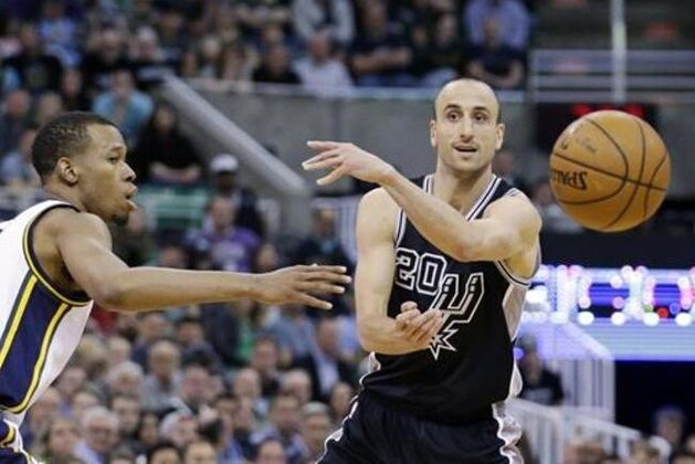 FILE - In this April 5, 2016, file photo, Utah Jazz guard Rodney Hood, left, guards San Antonio Spurs guard Manu Ginobili (20) as he passes the ball during the second quarter of an NBA basketball game in Salt Lake City. Ginobili said he is coming back for a 15th season in the NBA. Ginobili made the announcement on his personal blog Sunday, July 3, 2016. (AP Photo/Rick Bowmer, File)