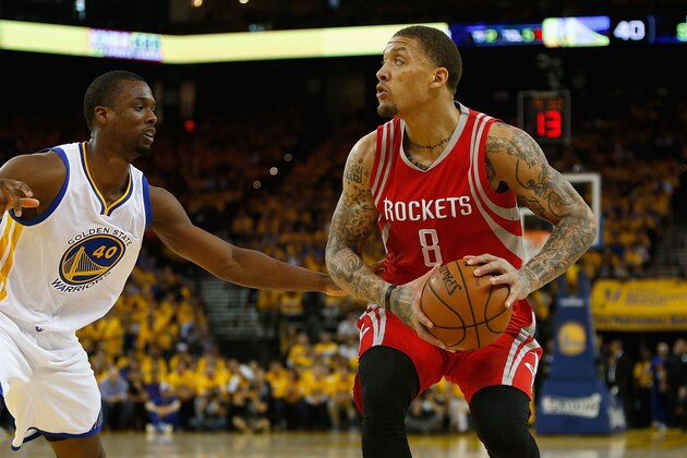 OAKLAND, CA - APRIL 18: Michael Beasley #8 of the Houston Rockets looks to shoot against Harrison Barnes #40 of the Golden State Warriors in the second quarter in Game Two of the Western Conference Quarterfinals during the 2016 NBA Playoffs at ORACLE Arena on April 18, 2016 in Oakland, California. NOTE TO USER: User expressly acknowledges and agrees that, by downloading and or using this photograph, user is consenting to the terms and conditions of Getty Images License Agreement. (Photo by Lachlan Cunningham/Getty Images)