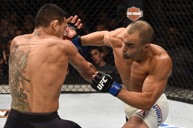 LAS VEGAS, NV - JULY 07:   (R-L) Eddie Alvarez punches Rafael Dos Anjos of Brazil in their lightweight championship bout during the UFC Fight Night event inside the MGM Grand Garden Arena on July 7, 2016 in Las Vegas, Nevada. (Photo by Jeff Bottari/Zuffa LLC/Zuffa LLC via Getty Images)