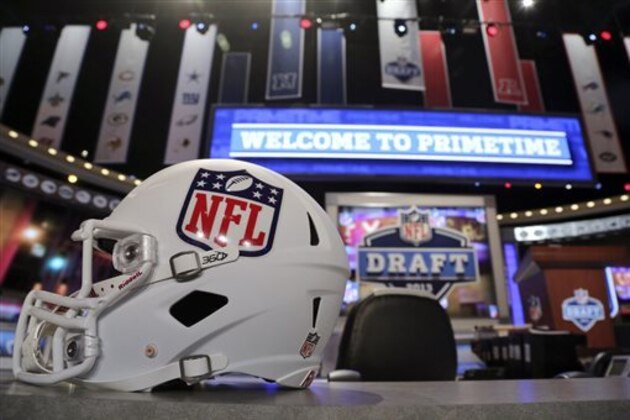 A helmet with the NFL logo is placed on a table before the NFL football draft, Thursday, April 25, 2013, at Radio City Music Hall in New York. (AP Photo/Mary Altaffer)