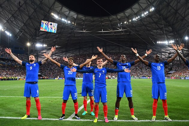 From left: France's forward Olivier Giroud, forward Kingsley Coman, defender Laurent Koscielny,  forward Antoine Griezmann, midfielder Paul Pogba, France's defender Eliaquim Mangala celebrate after beating Germany 2-0 in the Euro 2016 semi-final football match between Germany and France at the Stade Velodrome in Marseille on July 7, 2016.
France will face Portugal in the Euro 2016 finals on July 10, 2016. / AFP / FRANCK FIFE        (Photo credit should read FRANCK FIFE/AFP/Getty Images)