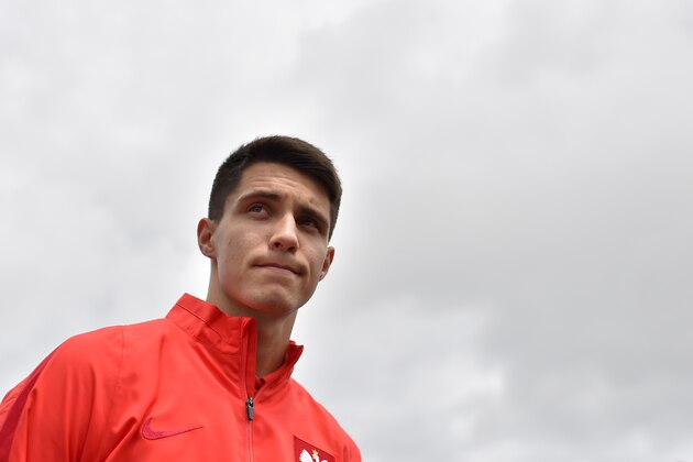 Poland's midfielder Bartosz Kapustka leaves after a press conference in La Baule, western France, on June 14, 2016, during the Euro 2016 football tournament. / AFP / LOIC VENANCE        (Photo credit should read LOIC VENANCE/AFP/Getty Images)