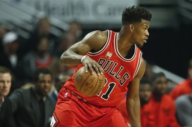 Chicago Bulls guard Jimmy Butler looks to pass the ball against the Philadelphia 76ers during the first half of an NBA basketball game, Wednesday, April 13, 2016 in Chicago. (AP Photo/Kamil Krzaczynski)