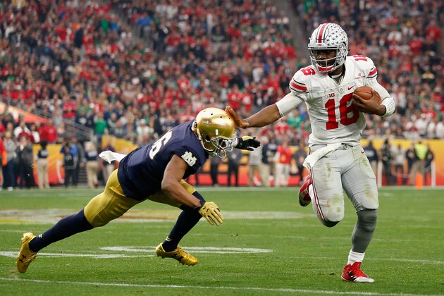 GLENDALE, AZ - JANUARY 01:  Quarterback J.T. Barrett #16 of the Ohio State Buckeyes scrambles with the football past cornerback Cole Luke #36 of the Notre Dame Fighting Irish during the BattleFrog Fiesta Bowl at University of Phoenix Stadium on January 1, 2016 in Glendale, Arizona. The Buckeyes defeated the Fighting Irish 44-28.  (Photo by Christian Petersen/Getty Images)
