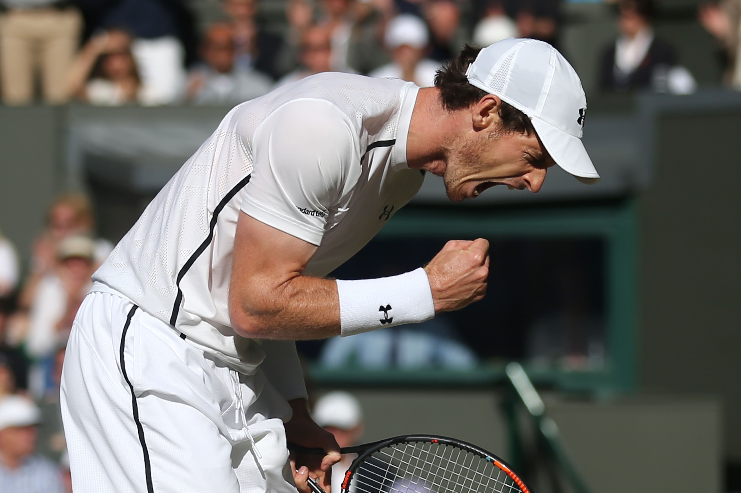 Britain's Andy Murray celebrates winning a point against Czech Republic's Tomas Berdych during their men's singles semi-final match on the twelfth day of the 2016 Wimbledon Championships at The All England Lawn Tennis Club in Wimbledon, southwest London, on July 8, 2016. / AFP / AFP AND POOL / JUSTIN TALLIS / RESTRICTED TO EDITORIAL USE        (Photo credit should read JUSTIN TALLIS/AFP/Getty Images)