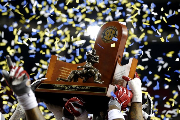 ATLANTA, GA - DECEMBER 5: Alabama Crimson Tide raise the trophy into the air after defeating the Florida Gators 29-15 in the SEC Championship game at the Georgia Dome on December 5, 2015 in Atlanta, Georgia. (Photo by Kevin C. Cox/Getty Images)