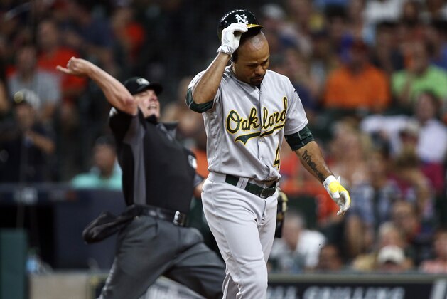 Jul 7, 2016; Houston, TX, USA; Oakland Athletics center fielder Coco Crisp (4) is ejected by home plate umpire D.J. Reyburn during the fifth inning against the Houston Astros at Minute Maid Park. Mandatory Credit: Troy Taormina-USA TODAY Sports