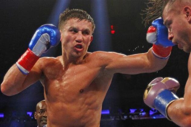 FILE - Gennady Golovkin, left, hits David Lemieux during a world middleweight championship title unification bout at Madison Square Garden in New York. Gennady Golovkin was searching for someone to fight him for the middleweight title. Kell Brook was more than eager to step up for the challenge. Brook will move up two weight classes to face the fearsome Golovkin on Sept. 10 in a clash of unbeaten champions. (AP Photo/Rich Schultz, File)