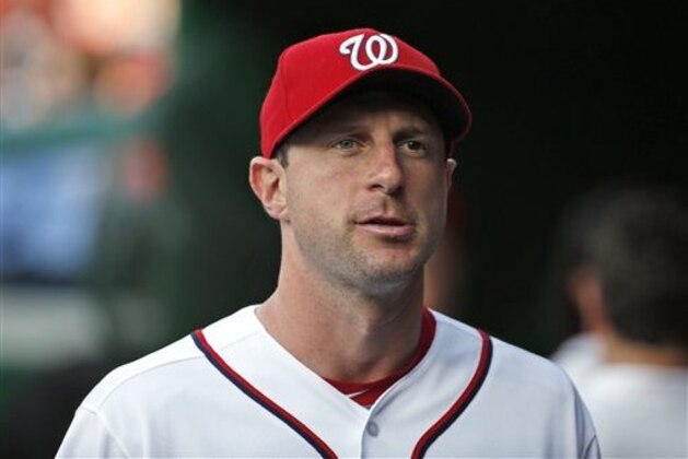 Washington Nationals starting pitcher Max Scherzer (31) walks in the dugout before a baseball game against the Milwaukee Brewers at Nationals Park, Tuesday, July 5, 2016, in Washington. (AP Photo/Alex Brandon)