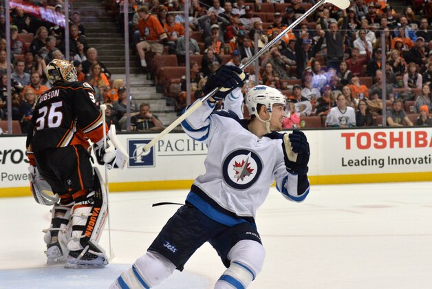 Apr 5, 2016; Anaheim, CA, USA; Winnipeg Jets center Mark Scheifele (55) celebrates after Jets 2-1 victory in overtime as Anaheim Ducks goalie John Gibson (36) reacts during an NHL game at Honda Center. Mandatory Credit: Kirby Lee-USA TODAY Sports