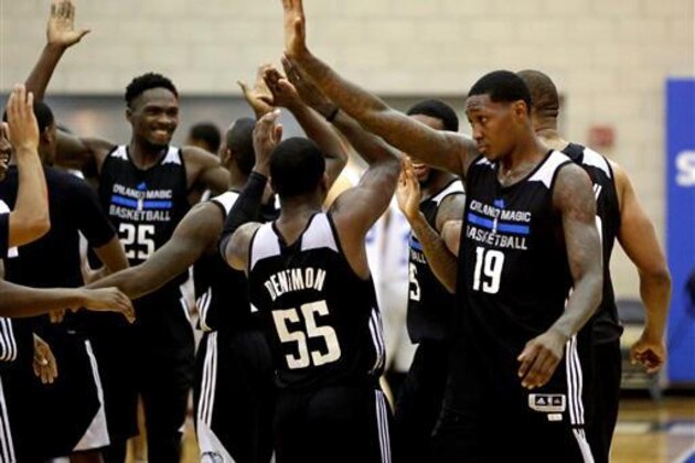 Orlando Magic White players celebrate after Justin Dentmon (55) made the game winning shot in overtime of an NBA summer league basketball game to defeat the Detroit Pistons 87-84, Friday, July 8, 2016, in Orlando, Fla. (AP Photo/John Raoux)