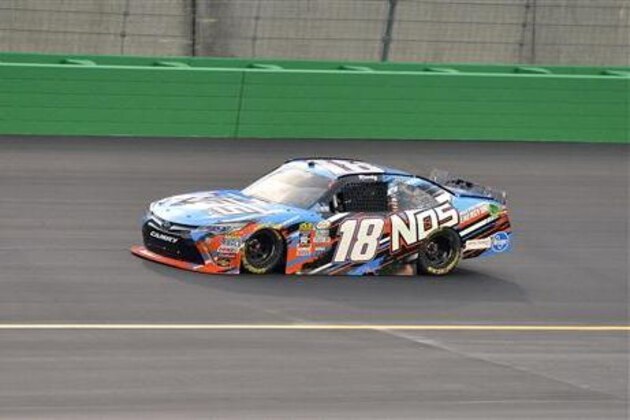 Kyle Busch leads the pack into Turn 1 during the NASCAR Xfinity Series Alsco 300 auto race at Kentucky Speedway, Friday, July 8, 2016, in Sparta, Ky. (AP Photo/Timothy D. Easley)