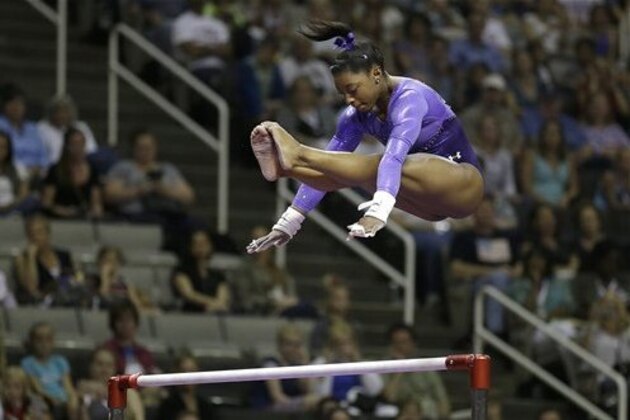 Simone Biles competes on the uneven bars during the women's U.S. Olympic gymnastics trials in San Jose, Calif., Friday, July 8, 2016. (AP Photo/Ben Margot)