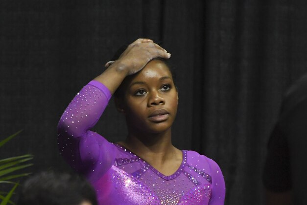 July 8, 2016; San Jose, CA, USA; Gabby Douglas, from Tarzana, CA, reacts after the balance beam in the women's gymnastics U.S. Olympic team trials at SAP Center. Mandatory Credit: Kyle Terada-USA TODAY Sports