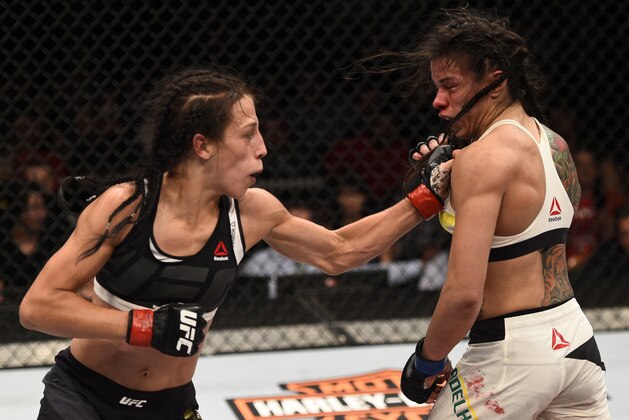 LAS VEGAS, NV - JULY 08:  (L-R) Joanna Jedrzejczyk of Poland punches Claudia Gadelha of Brazil in their women's strawweight championship bout during The Ultimate Fighter Finale event at MGM Grand Garden Arena on July 8, 2016 in Las Vegas, Nevada.  (Photo by Jeff Bottari/Zuffa LLC/Zuffa LLC via Getty Images)