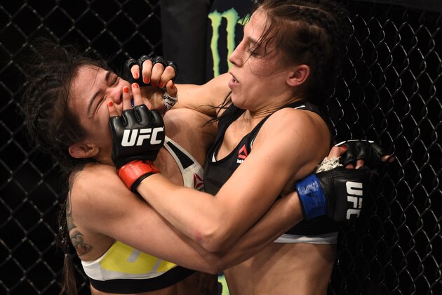 LAS VEGAS, NV - JULY 08:  (R-L) Joanna Jedrzejczyk of Poland defends against a takedown attempt by Claudia Gadelha of Brazil in their women's strawweight championship bout during The Ultimate Fighter Finale event at MGM Grand Garden Arena on July 8, 2016 in Las Vegas, Nevada.  (Photo by Jeff Bottari/Zuffa LLC/Zuffa LLC via Getty Images)