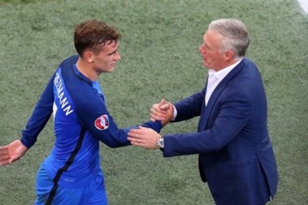 France coach Didier Deschamps, right, greet France's Antoine Griezmann during the Euro 2016 semifinal soccer match between Germany and France, at the Velodrome stadium in Marseille, France, Thursday, July 7, 2016. (AP Photo/Thibault Camus)