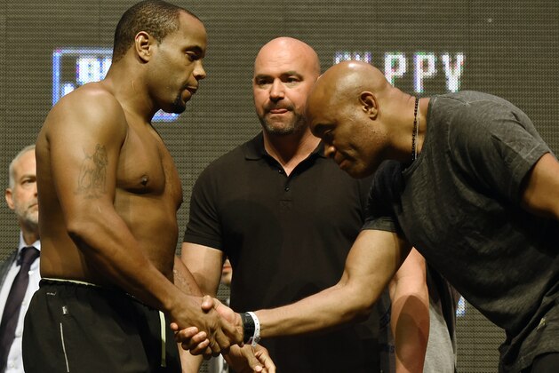LAS VEGAS, NV - JULY 08:  UFC President Dana White (C) looks on as mixed martial artist Anderson Silva (R) shakes hands with and bows to mixed martial artist Daniel Cormier (L) as they face off at their weigh-in for UFC 200 at T-Mobile Arena on July 8, 2016 in Las Vegas, Nevada. The fighters will meet in a non-title light heavyweight bout on July 9 at T-Mobile Arena. Silva replaces Jon Jones who was pulled from a light heavyweight title fight against Cormier due to a potential violation of the UFC's anti-doping policy.  (Photo by Ethan Miller/Getty Images)