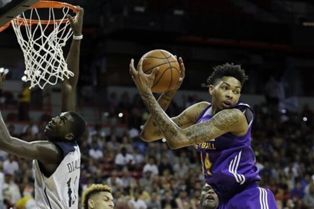 Los Angeles Lakers' Brandon Ingram grabs a rebound over the New Orleans Pelicans during the first half of an NBA summer league basketball game Friday, July 8, 2016, in Las Vegas. (AP Photo/John Locher)