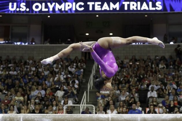Gabrielle Douglas competes on the balance beam during the women's U.S. Olympic gymnastics trials in San Jose, Calif., Friday, July 8, 2016. (AP Photo/Gregory Bull)