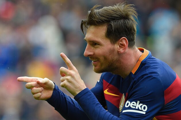 Barcelona's Argentinian forward Lionel Messi celebrates after scoring a goal during the Spanish league football match FC Barcelona vs RCD Espanyol at the Camp Nou stadium in Barcelona on May 8, 2016. / AFP / LLUIS GENE        (Photo credit should read LLUIS GENE/AFP/Getty Images)